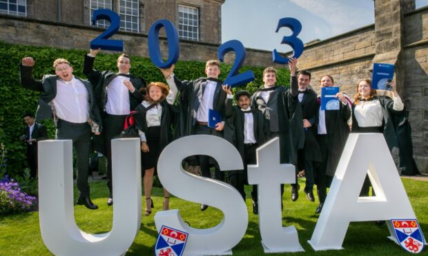 Jumping for joy are Science of Physics & Astro Physics Graduates. Left to right is Fergus Williams, Ross Carter, Chantelle Lau, Nikhil Sivanandan, Jospeh Brennan, Jack Colbeck, Ed Crtichley and Ann Nicholson.