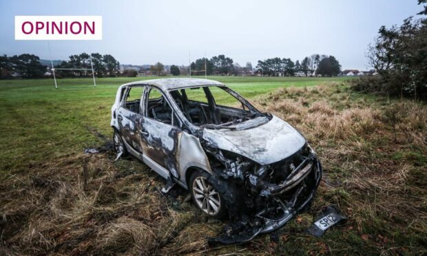 Burnout car on rugby playing fields in Dundee.