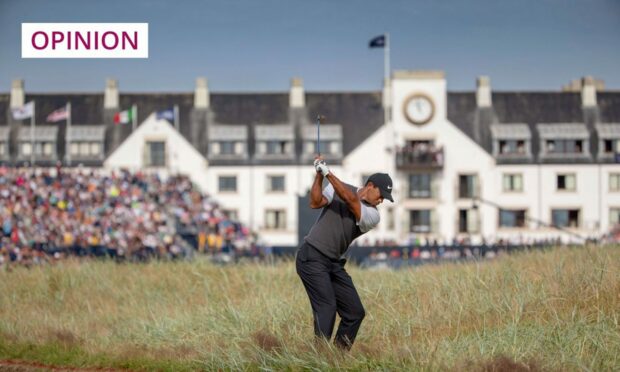 Tiger Woods playing in front of the Carnoustie Golf Links clubhouse at The open Championship in 2018.
