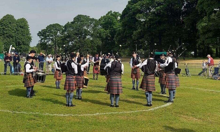 Lochgelly High School Pipe Band, from Fife, in action