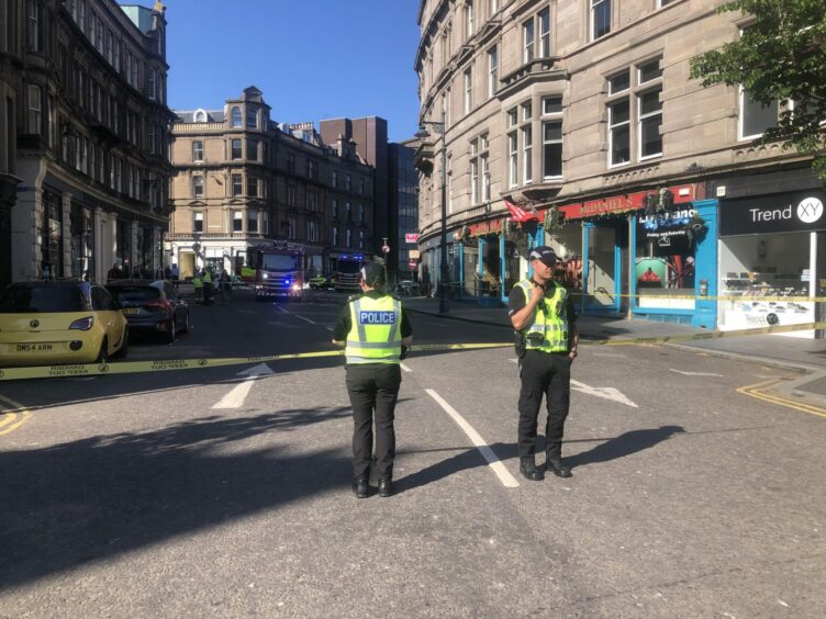 Police standing at Whitehall Place, Dundee.