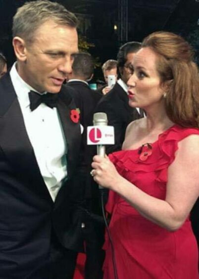 Martel Maxwell on red carpet with James Bond actor Daniel Craig.