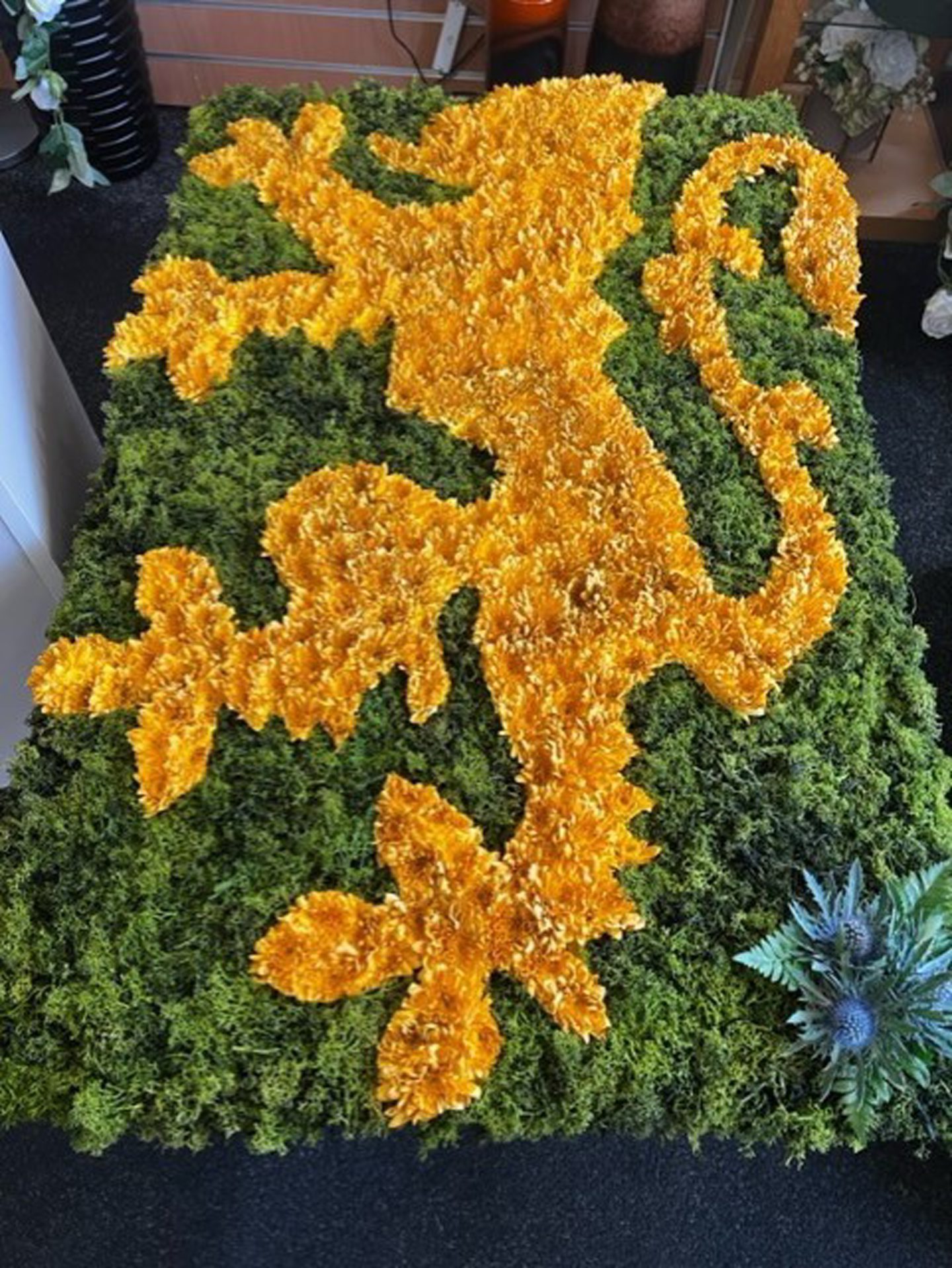The Golden Lion floral tribute
