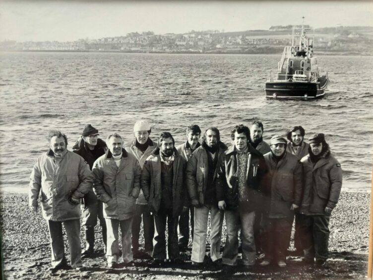 Frank Donnelly, shown centre, seventh from left, with former RNLI crew members.