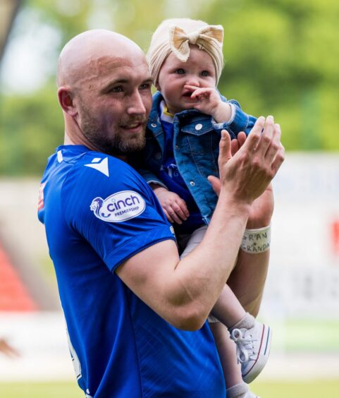 Chris Kane with his young daughter. 