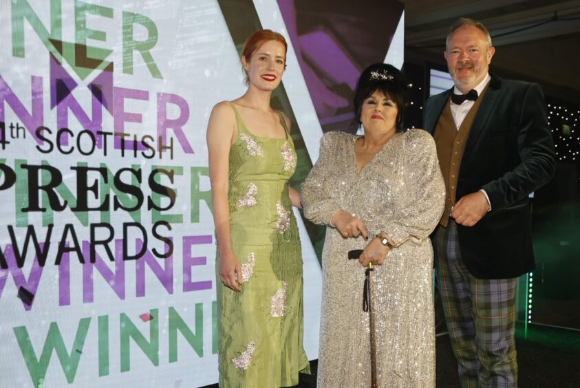 The Sunday Post journalist Marion Scott, centre, pictured with her Nicola Barry Award at the Scottish Press Awards. Image: Andrew Barr.