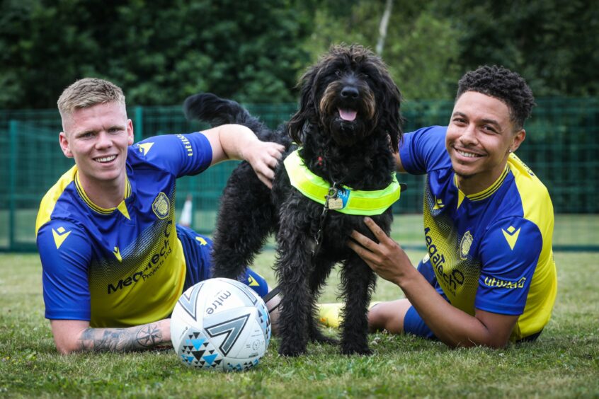 Arbroath FC players Aaron Steele and Leighton McIntosh visit Guide Dogs Scotland.