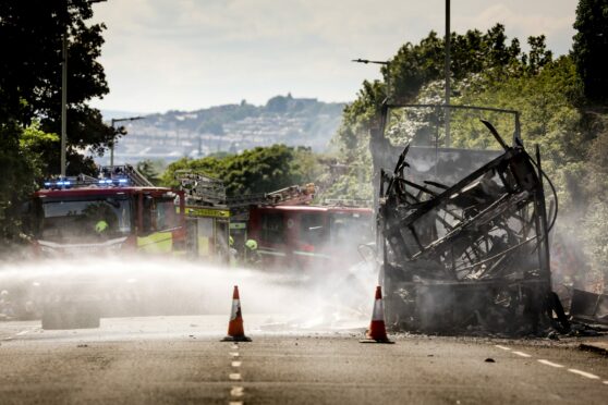 The wreckage of the bus destroyed by the fire. Image: Mhairi Edwards/DC Thomson