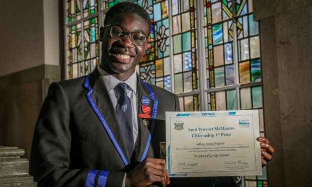 Jeffrey Addai-Peprah with his McManus Prize certificate in Dundee City Chambers.