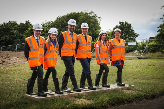 Pupils Gareth Stubbs, Rachael Watson and Chrissy Batchelor with  Robertson Construction MD Doug Keillor, head teacher Andrew Dingwall and Angus Council leader Beth Whiteside mark the start of the project. Image: Mhairi Edwards/DC Thomson
