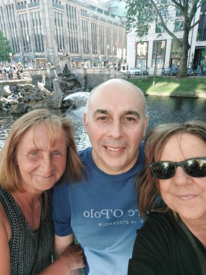 Ross with his wife Amanda Morrison (right) and sister-in-law Hazel Connolly (left) in Dusseldorf in Germany.