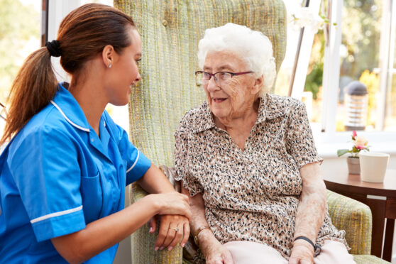 A photo of a carer with elderly lady.