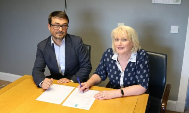 Barthelemy Fourment from Paprec, and Barbara Renton, Perth and Kinross Council's executive director (Communities) sign the agreement. Image: Perth and Kinross Council.