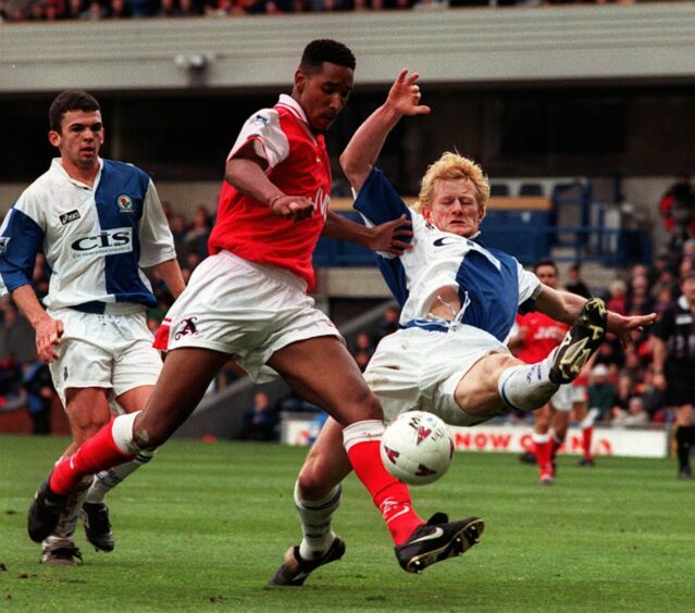 Nicolas Anelka during his Arsenal days against Scotland defender Colin Hendry.