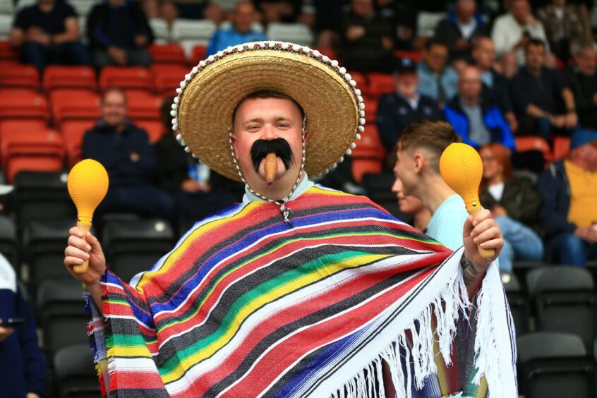 Dundee fans in a Mexican mood ahead of kick-off with new signing Diego Pineda on the bench. Image: David Young/Shutterstock 