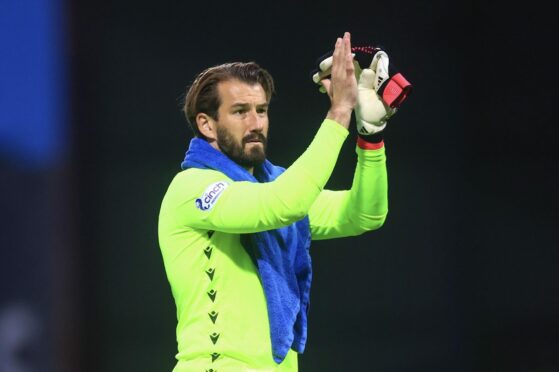 Adam Legzdins applauds Dundee fans after the win over Dumbarton. Image: David Young/Shutterstock