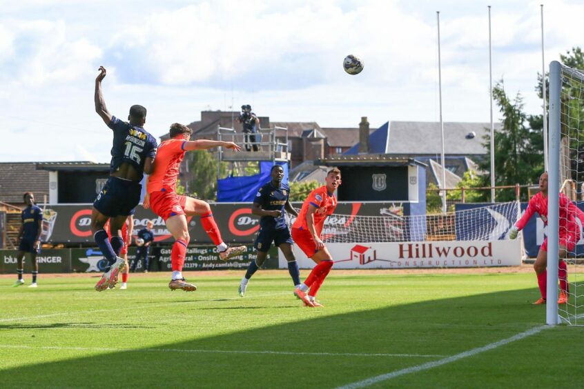 Zach Robinson heads in the only goal against Inverness. Image: David Young/Shutterstock