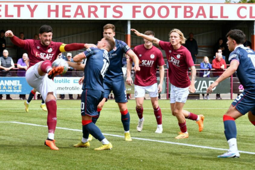 Vaughan tussles with Kelty Hearts captain Tam O'Ware. Image: Raith Rovers.