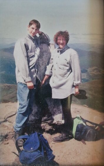 Iain Cotterell, aged 20, on top of Ben Vorlich with his mother Maureen in the 1990s.