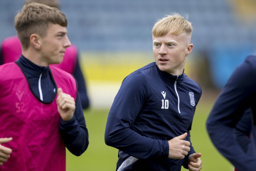 Lyall Cameron (right) chats to Ross Clark as Dundee train at Dens Park. Image: SNS.