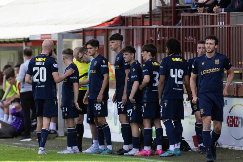 Dundee youngsters get ready to enter the pitch.