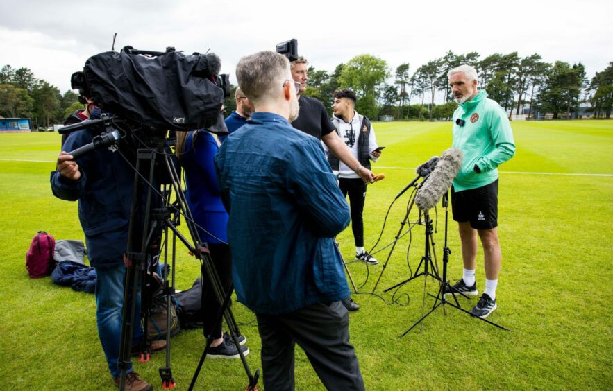 Jim Goodwin speaks to the broadcast media at Dundee United's St Andrew's training base