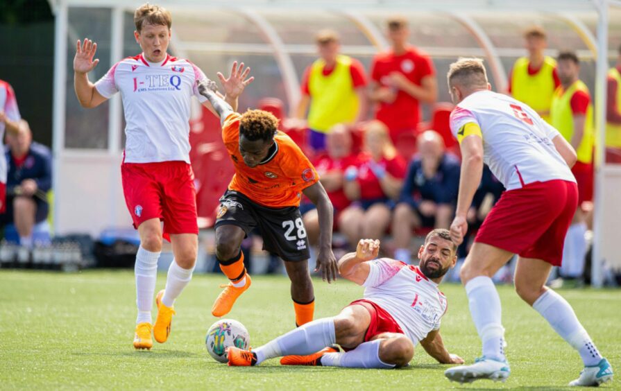 Dundee United's Mathew Cudjoe is halted by Jordan Tapping of Spartans.