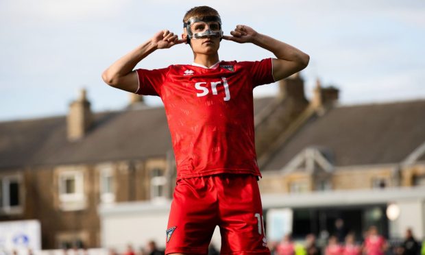 Dunfermline Athletic F.C. star Matty Todd stands with his fingers in his ears as he looks towards the Raith Rovers supporter following July's cup tie.