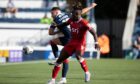 Ewan Otoo challenges Raith Rovers' Lewis Vaughan. Image: SNS.