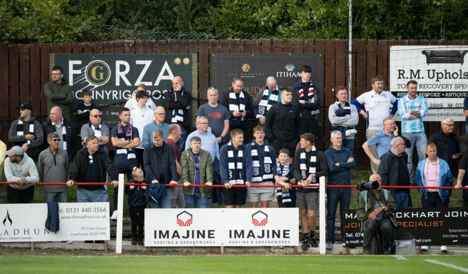 Dundee fans watch on at New Dundas Park. Image: SNS