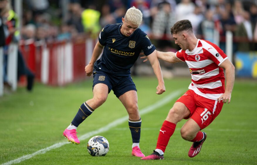 Luke McCowan takes on Bonnyrigg Rose. Image: SNS