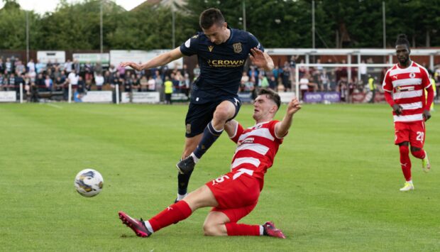 Cammy Kerr takes on Reis Peggie as Dundee faced Bonnyrigg Rose. Image: SNS.