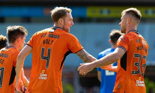 Kevin Holt and Scott McMann of Dundee United