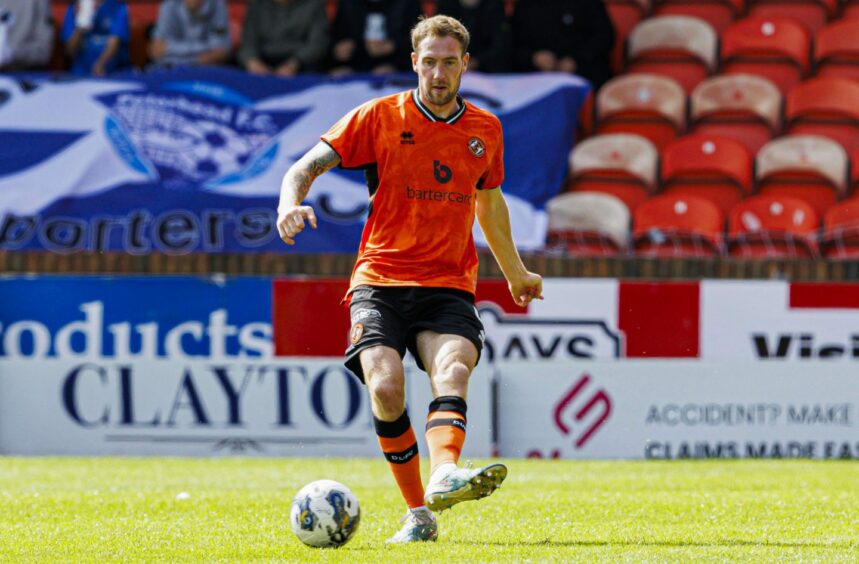 DUndee United centre-back Kevin Holt in action