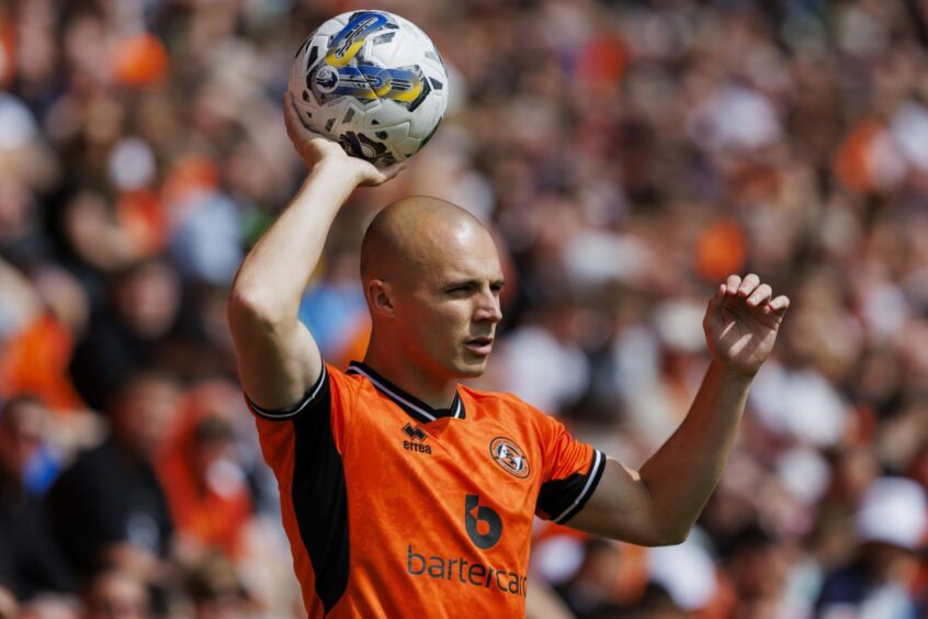 Liam Grimshaw takes a Dundee United throw at Tannadice, Dundee.