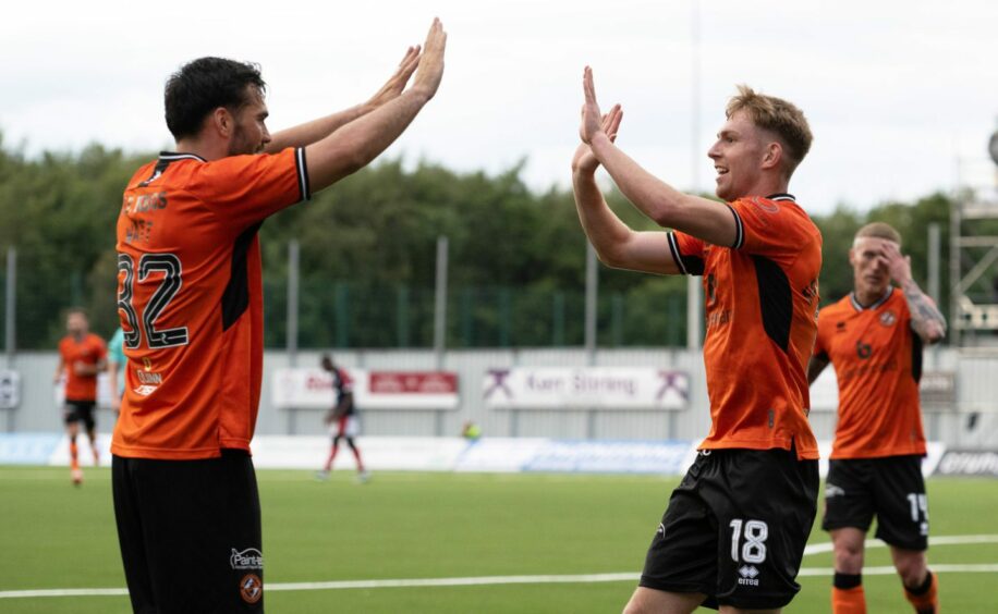 Fotheringham, right, celebrates the winning goal with Tony Watt