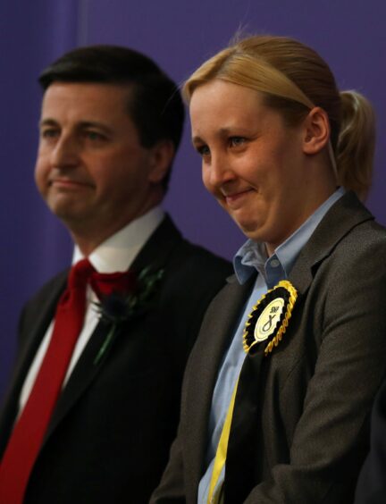 Mhairi Black and Douglas Alexander on stage at the Paisley election count, as her shock victory was announced.