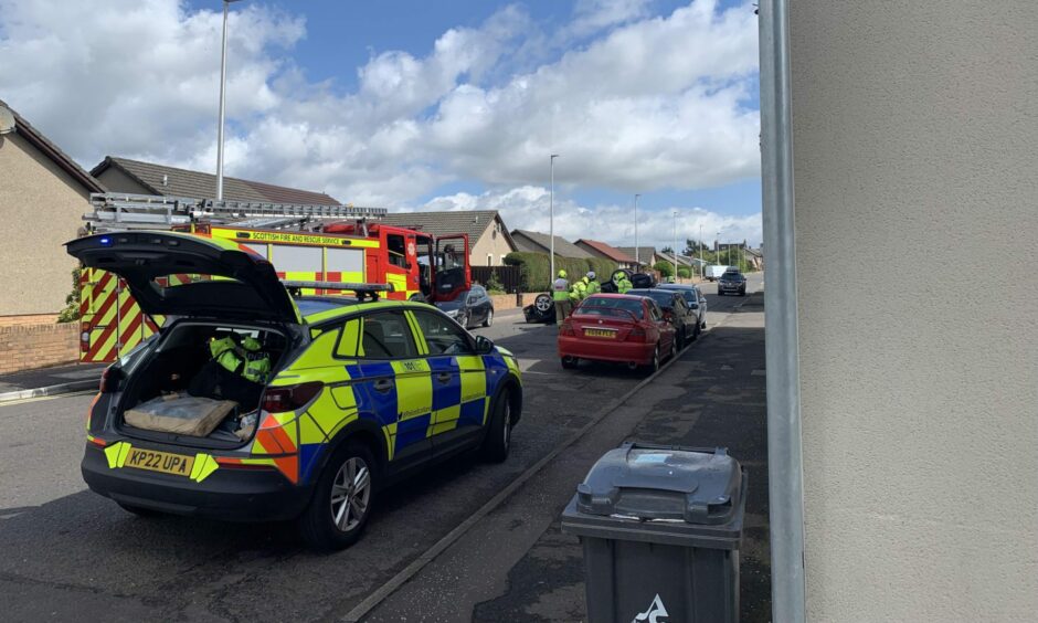 Car flipped onto its roof following a crash in Forfar.