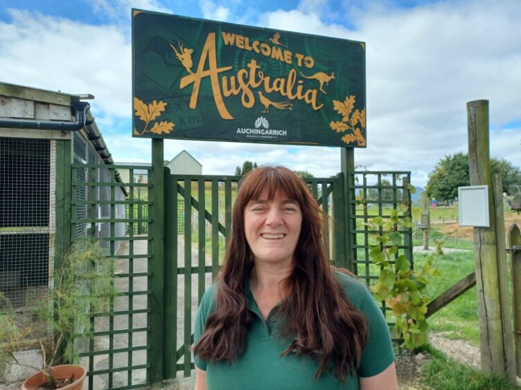 Alexa Reid next to a sign for the Auchingarrich wildlife park