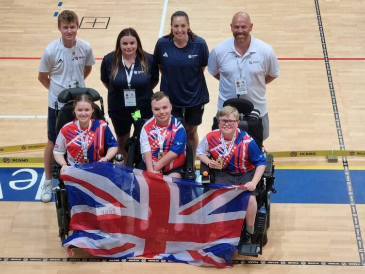 Boccia players Sophie Newnham (left) and Tyler McLelland (middle) with fellow GB competitor Harrison Smith, assistants and coach in Portugal.