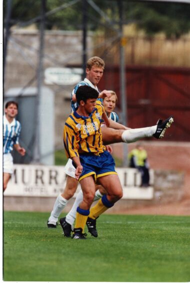 Callum Davidson in action in the yellow and blue stripes in 1994. 