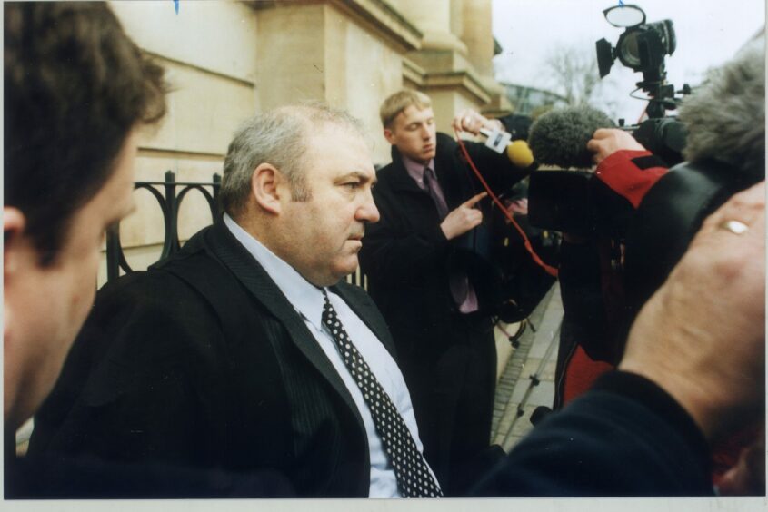 Mr Boyle with the press throng outside Dundee Sheriff Court while representing 'Saudi murder nurse' Lucille Ferrie in the 1990s.