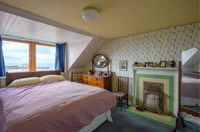 A bedroom at 3 The Terrace, Elie, with views over the beach