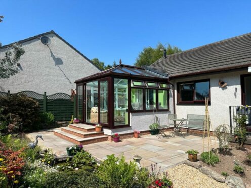 Exterior of a house with a conservatory roof replacement in Perth.