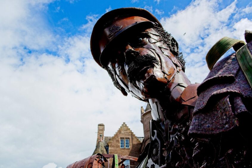 An imposing statue of a war-weary soldier.