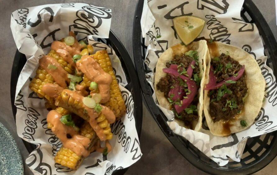 Two small dishes of elote ribs and mushroom tacos.