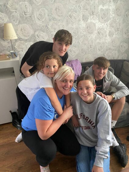 Izzy Tait from Dundee with her family - children Sophie, Kieran, Kyla and Connor with his partner Kelly. 