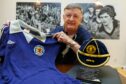 Paul Hegarty showed off his Scotland memorabilia during his visit to the Football Memories group. Image: Kenny Smith/DC Thomson.