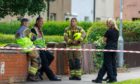 Fire and police officers after the Rosyth blaze was extinguished