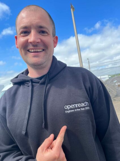 Lee Carmichael, from Glenrothes, is all smiles in his personalised Openreach hoodie.